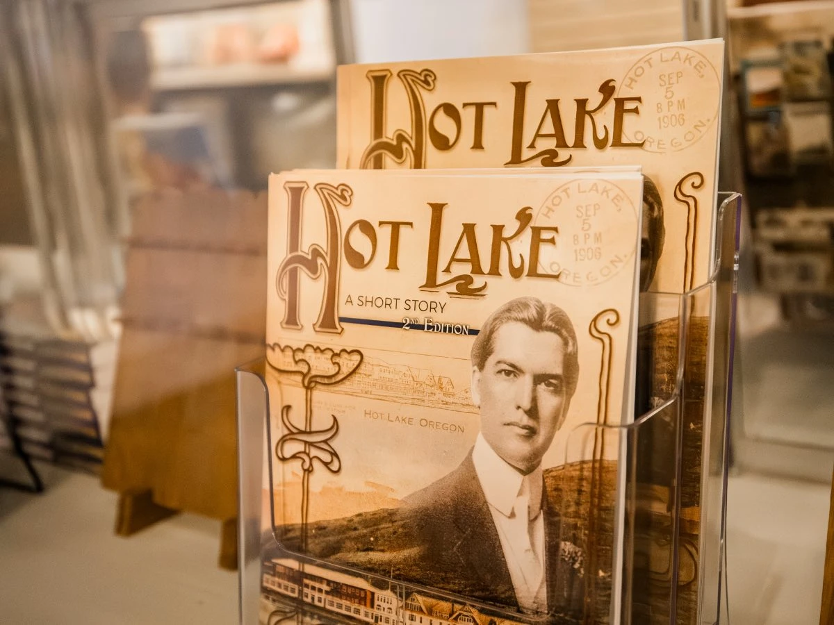 Close-up of "Hot Lake A Short Story" book in glass case at Hot Lake Springs Resort Gift Shop.